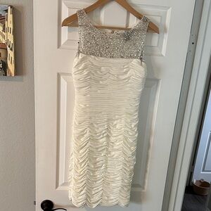 JS Boutique Ivory Sleeveless Dress with Embellished Neckline